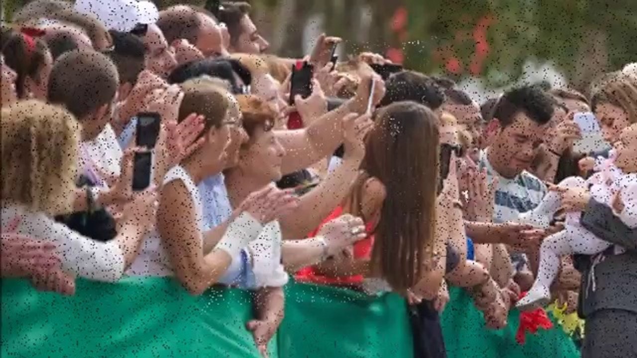 Queen Letizia takes cover behind her husband as they come face to face with angry-looking beast