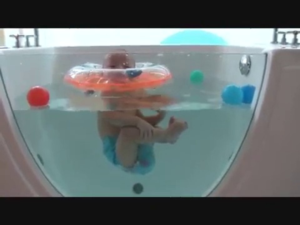 Triplets' first swimming lesson