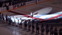 Singer falling down while he's singing Canadian anthem before NHM Hockey game!