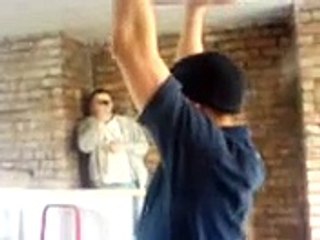 Fun in Garage - Man Holds Bag and it Brusts