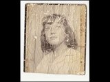 Restoration of a severely damaged photograph (c 1958)