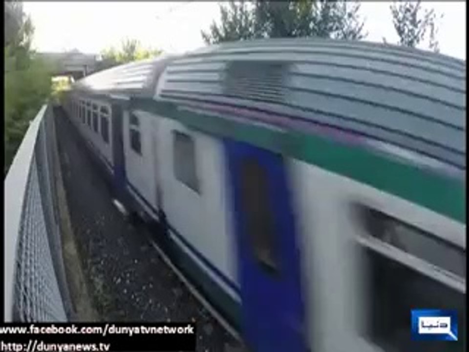 Dunya News - Italian teen lays between tracks and lets speeding train race over him -