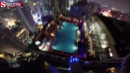 Gökdelenin tepesinden havuza böyle atladı!