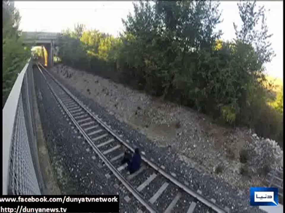 Italian teen lays between tracks and lets speeding train race over him