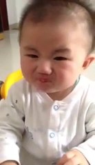baby eating lemon...beautiful reaction must watch
