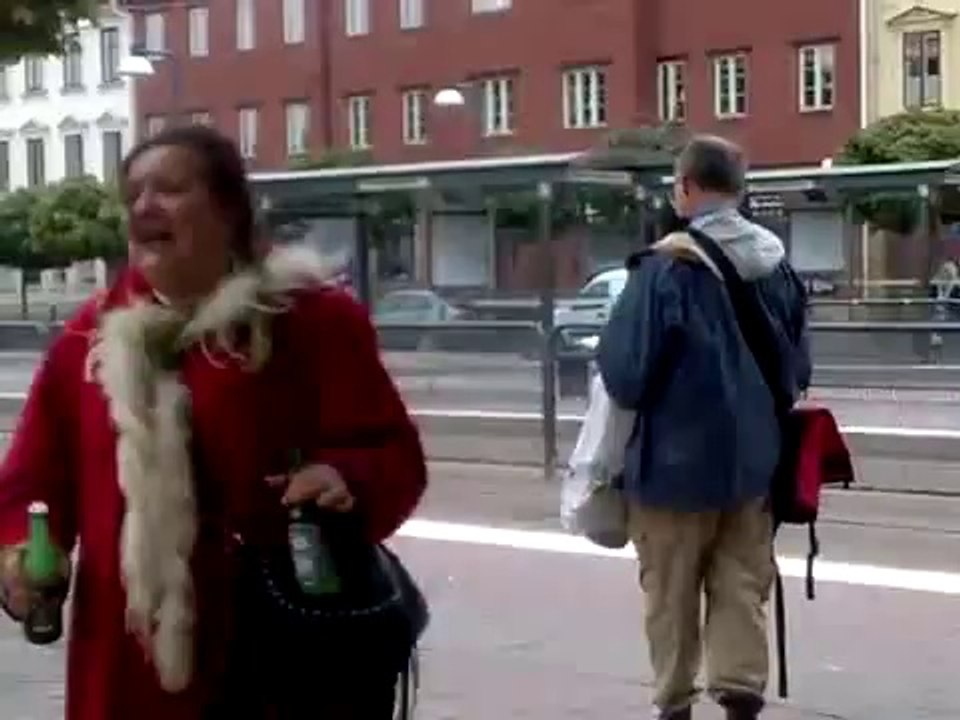 Drunk old woman shouts in the street