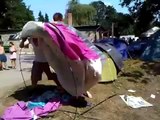 Two drunk guys trying to setting up a tent