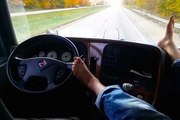 Ukranian Truck Driver Steer With One Foot While Sipping Cuppa In The Passenger Seat