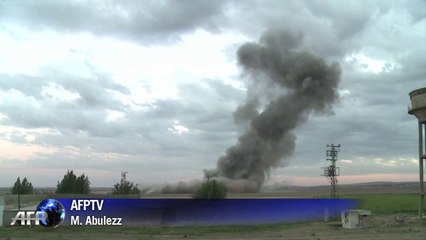 Air strike targets IS militants on a hill in Kobane