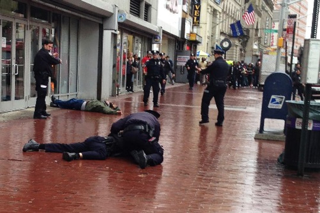 Man Shot Dead After Striking Cop in the Head with Axe