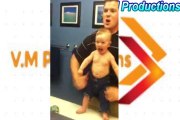 Baby adorably flexes muscles with dad