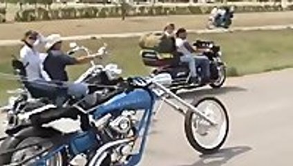 Guy makes a chariot using a motorcycle
