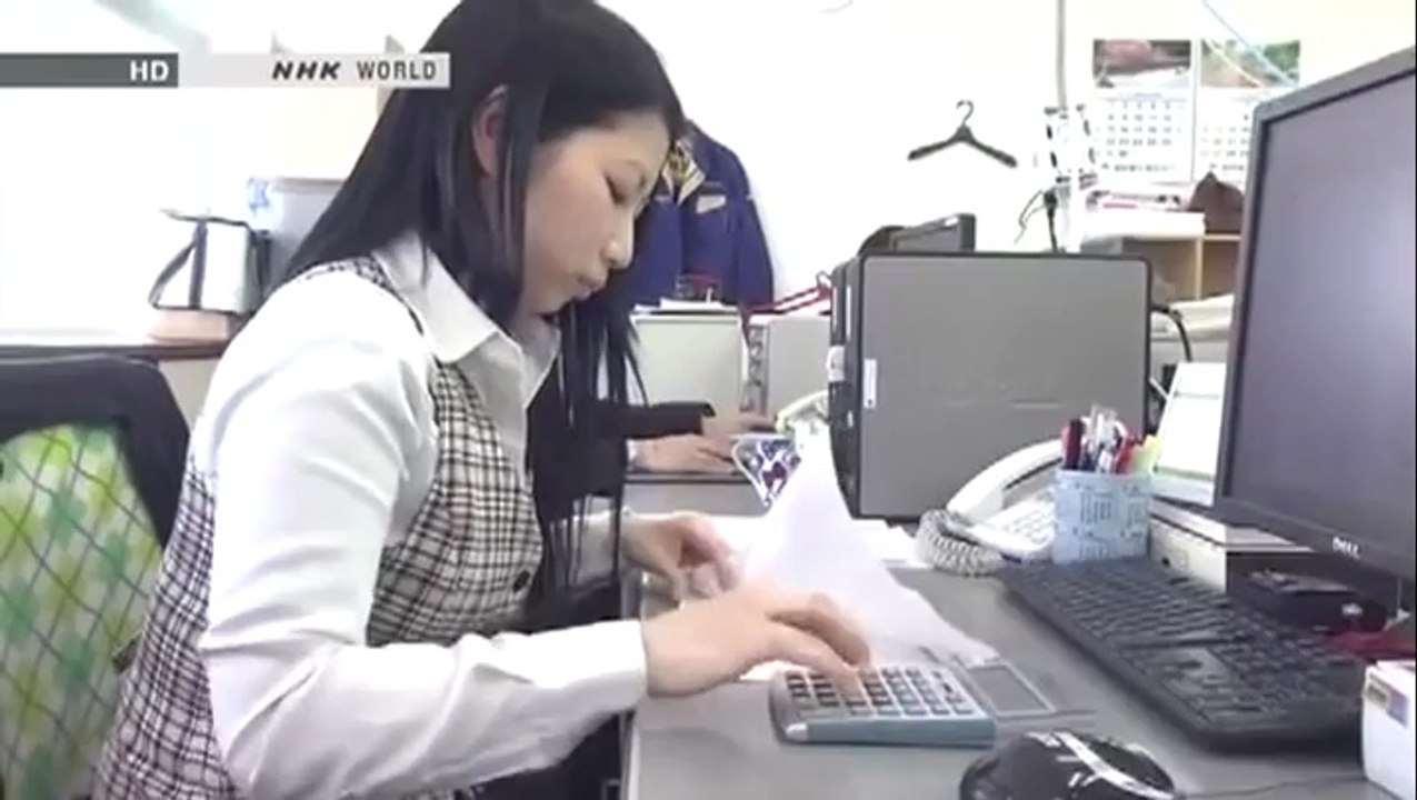 Japanese Girl Using a Calculator Like a Boss