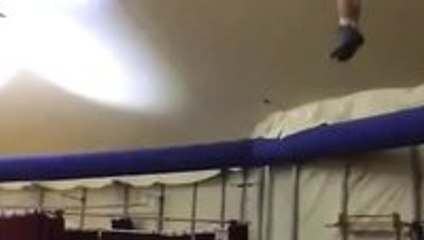 Two guys doing some incredible acrobatics on a seesaw