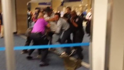 Homophobic Man Taken Down at Airport After Inciting Brawl Over "Queers"