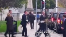 Man runs at British Prime Minister on city street