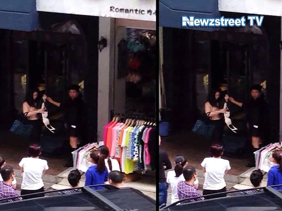 Female shoplifter stripped naked on street