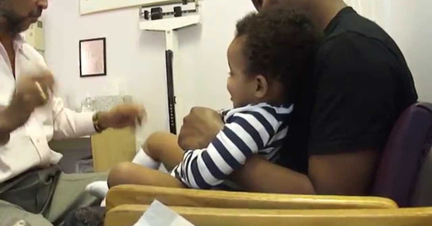 Baby laughing while getting shots