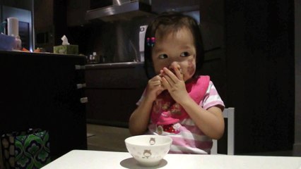 Girl Eating An Orange