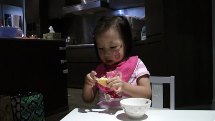 Girl Eating An Orange