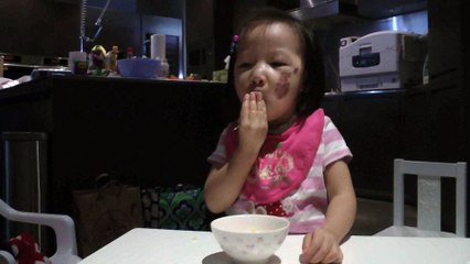 Girl Eating An Orange