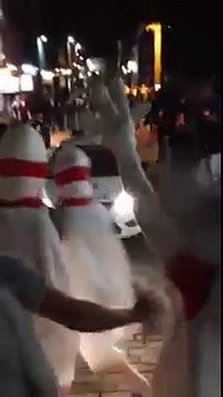 People dressed as bowling alley pins are ‘knocked down’ by police car