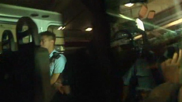 British banker charged with murder of two women arrives in Hong Kong court