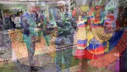 Prince Charles gets into the party spirit in Colombia and wears a traditional hat