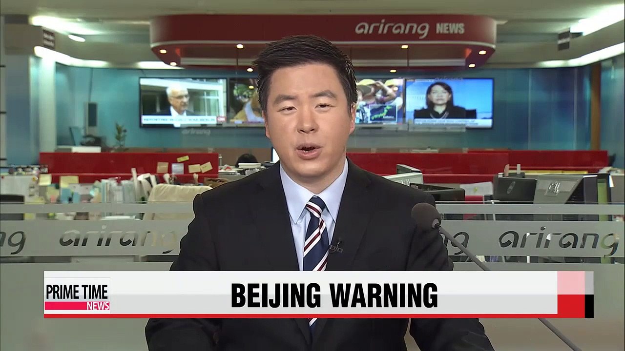 Beijing warns ex-British govenor to stay away from Hong Kong protest