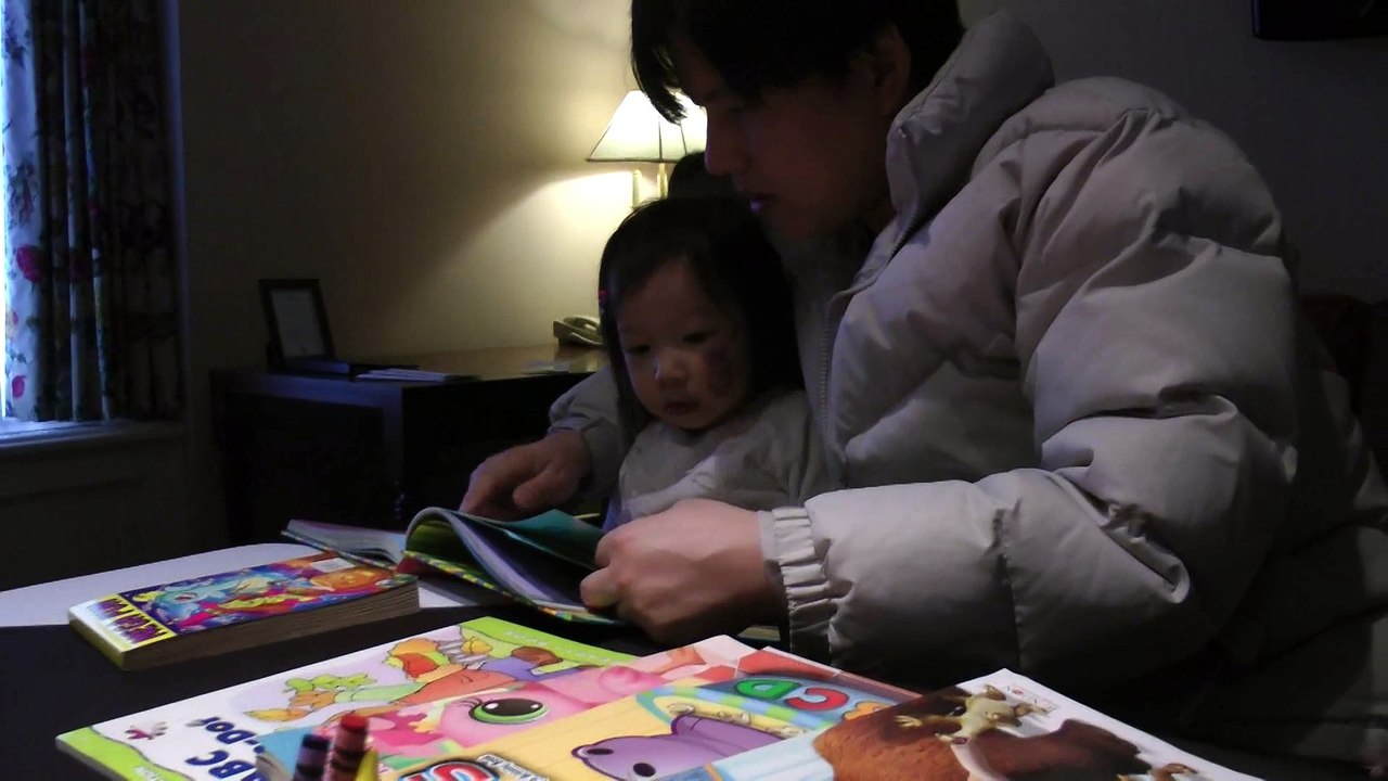Girl Reading Dora The Explorer
