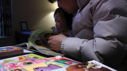 Girl Reading Dora The Explorer