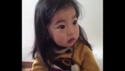 This little girl has her priorities straight