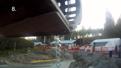 Stacking a tower of nuts with an excavator