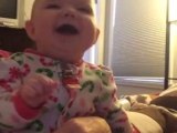 Baby laughing hysterically at older sister