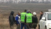 Dutch investigators collect remains at MH17 crash site