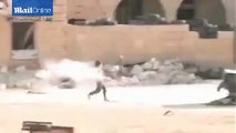 The incredible moment Syrian boy 'fakes death' to save girl