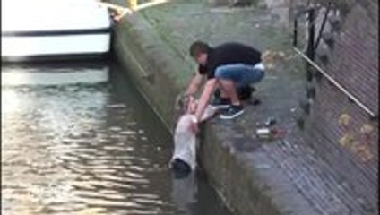 Tourists fall into canal