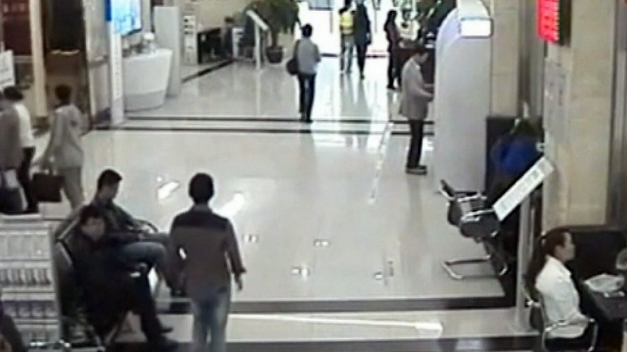 Thief captured on camera swiping money from bank counter
