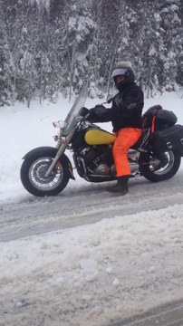 Motorcyclist in Snow - Crazy Canadian driving in snow and on ice!