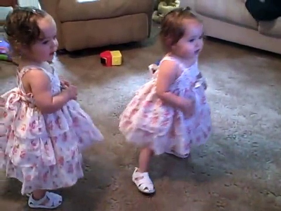 Twin babies dancing