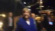 German chancellor Angela Merkel steps out of car to meet Brisbane locals