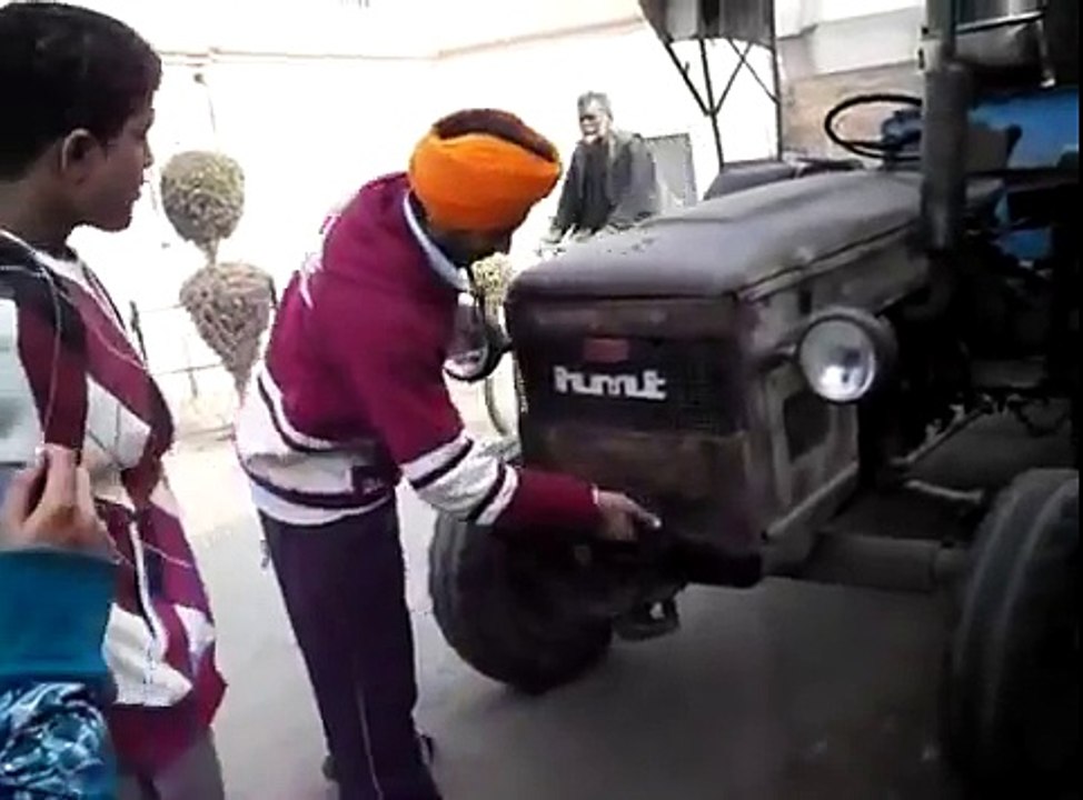 canadian boy starting indian tractor