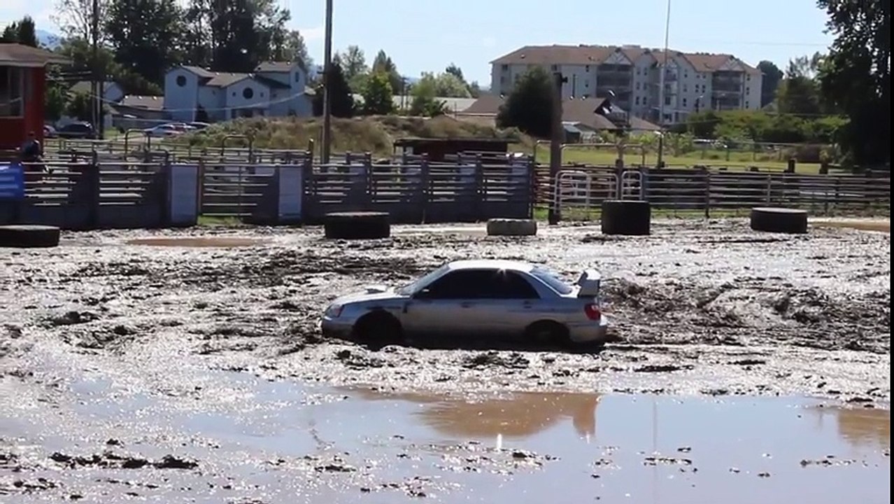 Subaru Impreza Battles Large Mud Pit