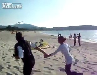 Firefighting Plane Refilling Next To Beach Shore