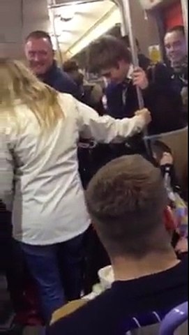 (20) WHUFC fans sharing banter with a schoolboy