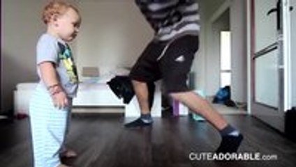 Adorable two year old baby dance battles dad