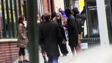 Madonna hobbles on crutches in NYC