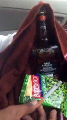 drunk man praying in front of vodka bottal