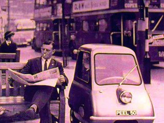 Perplexions - Reading a newspaper under a purple sky (Peel 50)