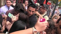 Harry Styles helps a girl who falls, Directioners swarm in NYC!